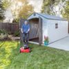 Lifetime 8x15 Outdoor Storage Shed 60075 man with lawnmower