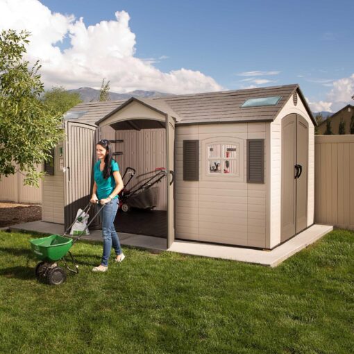 Lifetime 15 Ft. x 8 Ft. Outdoor Storage Shed 60079 with woman mowing