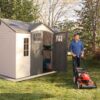 Lifetime Outdoor Storage Shed 60178 in use with lawn mower