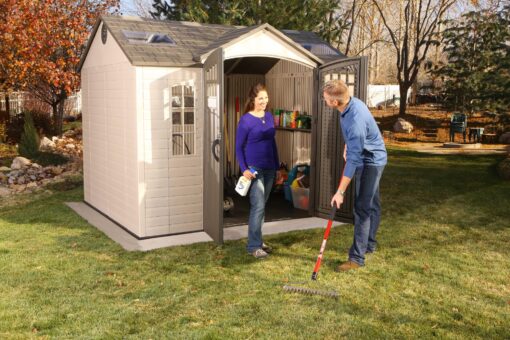Lifetime Outdoor Storage Shed 60178 side view with family activity