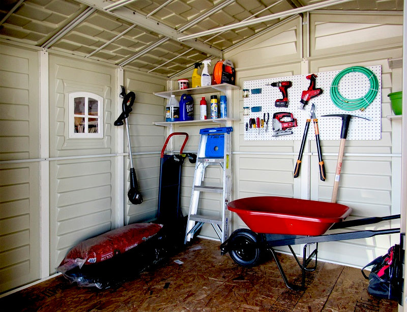 Interior look at Duramax Woodbridge Plus 10.5x8 Shed with smart storage solutions and tools organized efficiently.